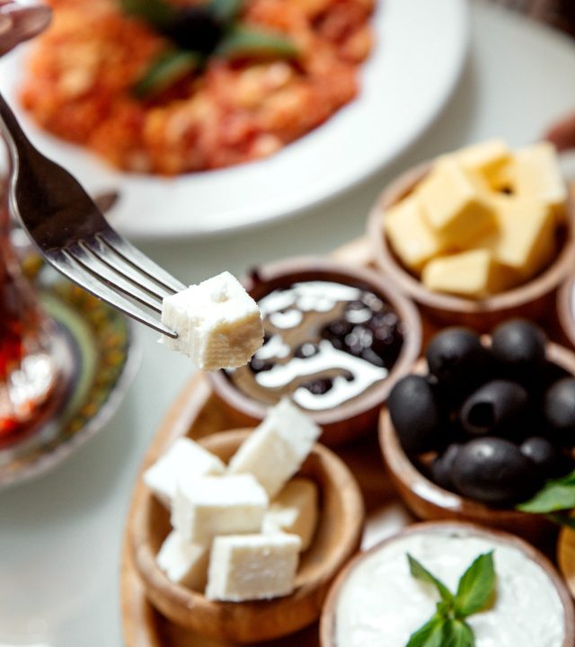 a piece of white cheese on fork